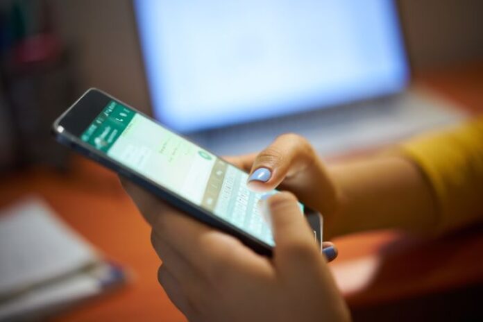 amp-girl-typing-phone-message-on-social-network-at-nig-ppvup54-1(2)