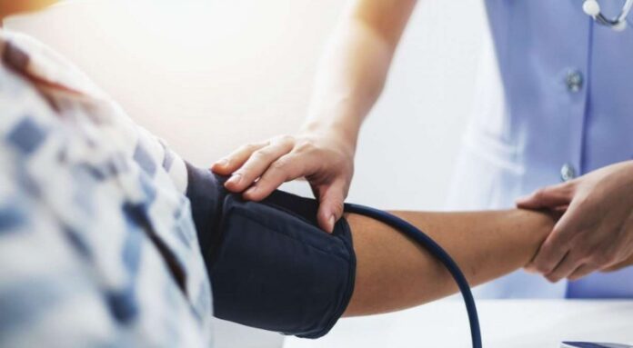 1_vecteezy_nurse_getting_vitals_of_patient_1397346-18815022