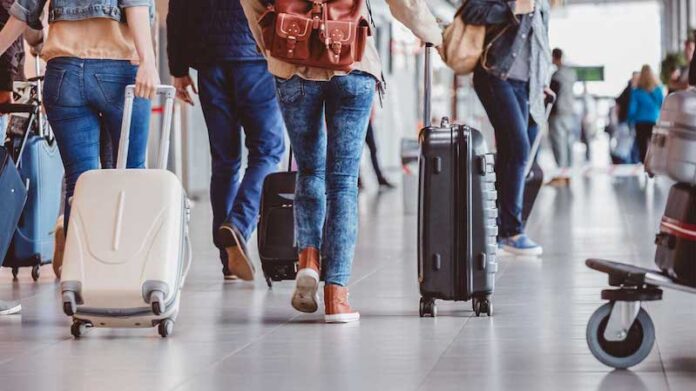 Passengers walking in the airport terminal