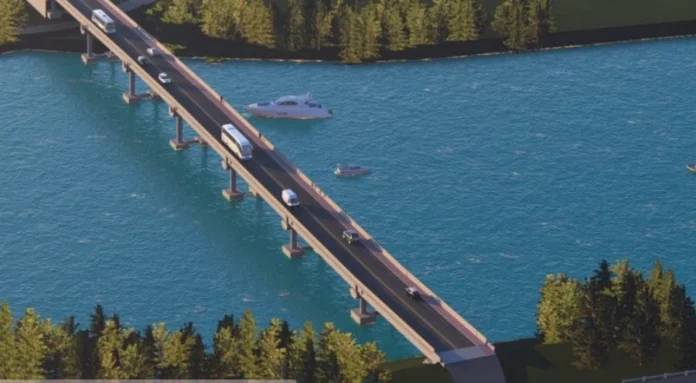 Araranguá avança na licitação da quarta ponte Perspectiva aérea de uma maquete eletrônica exibindo o projeto da quarta ponte de Araranguá. A imagem mostra uma estrutura moderna atravessando um rio de águas azuis, com tráfego de carros e ônibus sobre a pista, além de embarcações navegando próximas aos pilares e margens arborizadas.