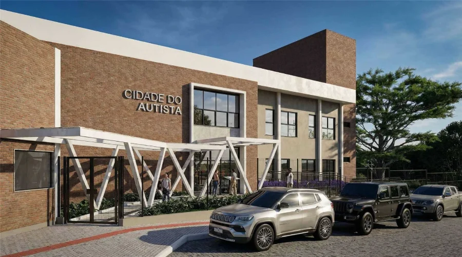 Fachada principal do projeto arquitetônico da Cidade do Autista em Criciúma com acabamento em tijolos e estrutura moderna no bairro Pinheirinho.