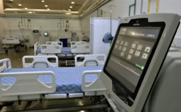 IA já é usada por 18% dos serviços de saúde no Brasil Leitos hospitalares e equipamento digital em unidade de saúde, em matéria sobre uso de inteligência artificial na saúde no Brasil