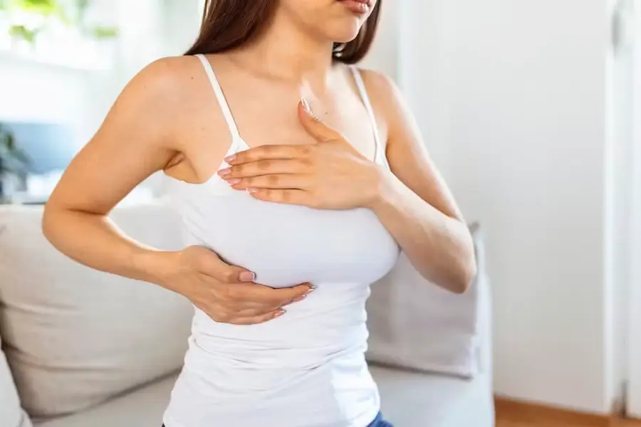 young-caucasian-woman-palpating-her-breast-by-herself-that-she-concern-about-breast-cancer-healthcare-breast-cancer-concept
