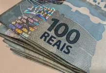 Tesouro eleva fatia da dívida atrelada à Selic em 2026 Cédulas de R$ 100 empilhadas ilustram Dívida Pública Federal, Tesouro Nacional e títulos atrelados à Taxa Selic.